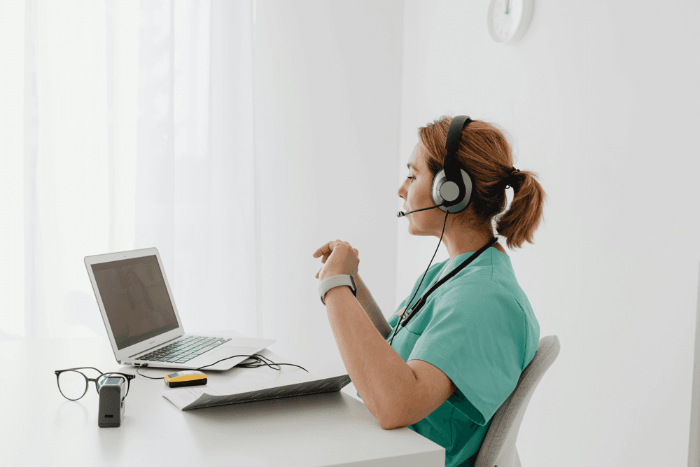 Doctor providing telehealth consultation on a laptop